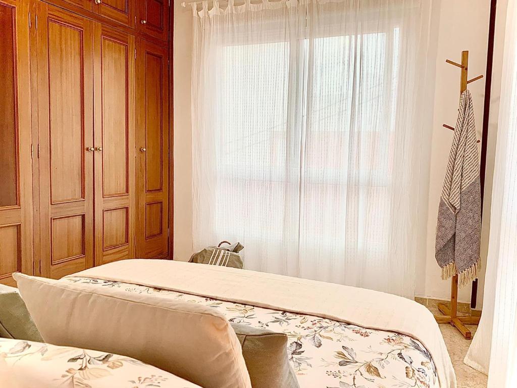Postel nebo postele na pokoji v ubytování Confortable apartamento en pueblo costero