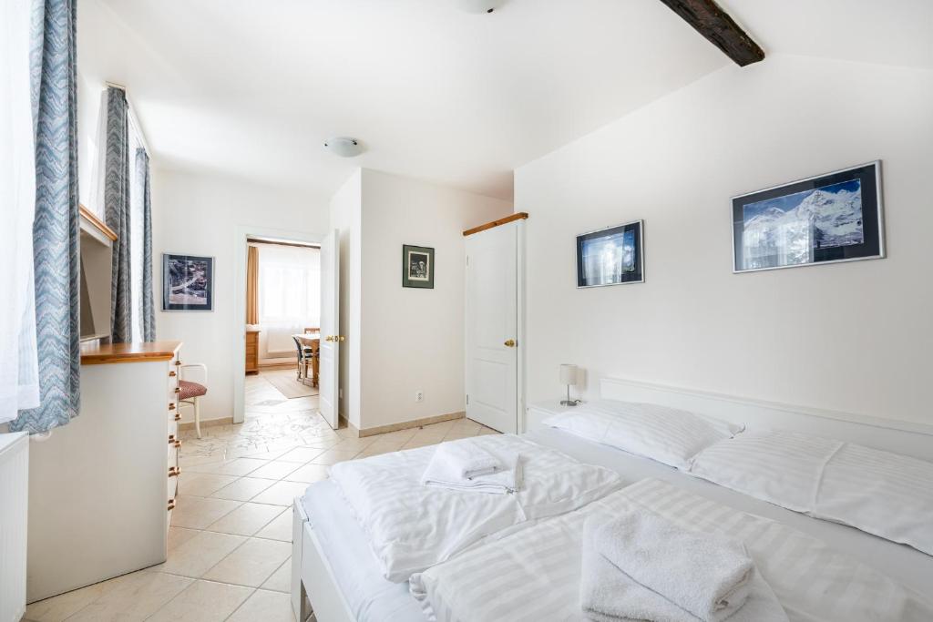 Postel nebo postele na pokoji v ubytování Apartmány Černý vlk, Kvilda
