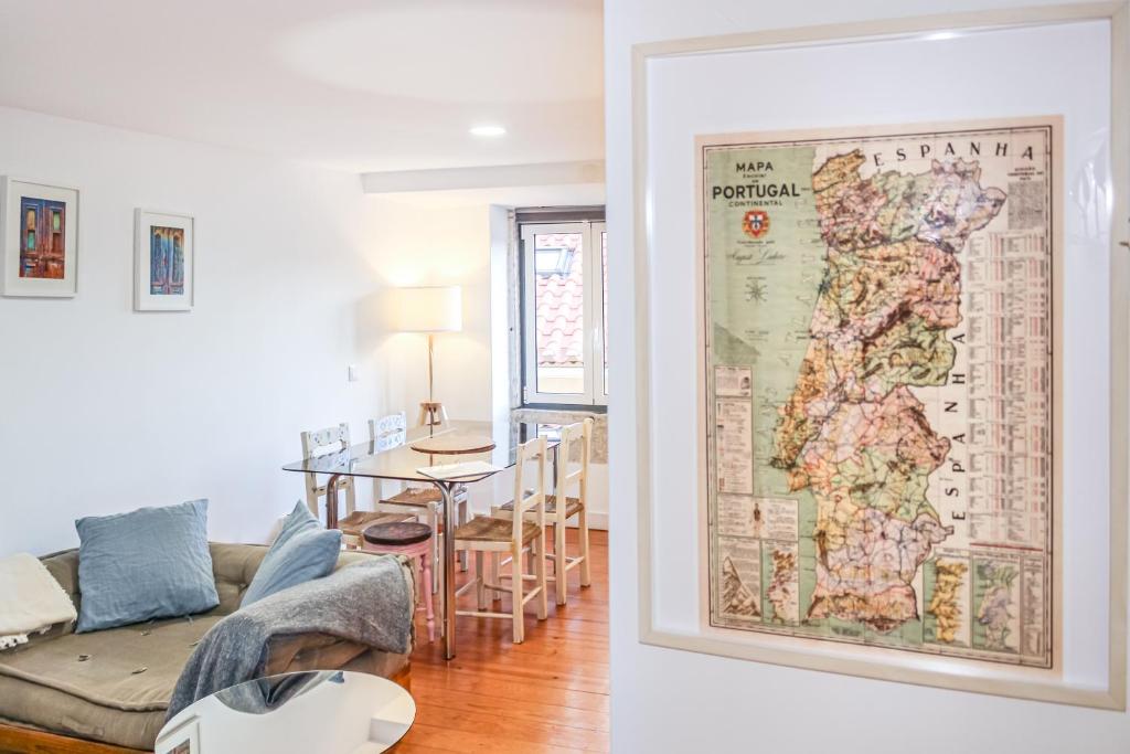 a living room with a map on the wall at The Lisbon-Way Apartments in Lisbon