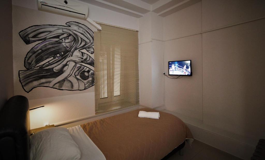TV a/nebo společenská místnost v ubytování Hotel Ambasador