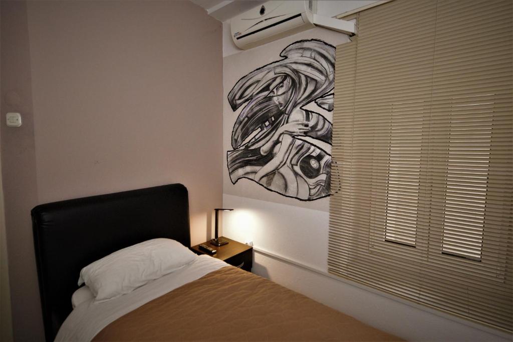 Postel nebo postele na pokoji v ubytování Hotel Ambasador