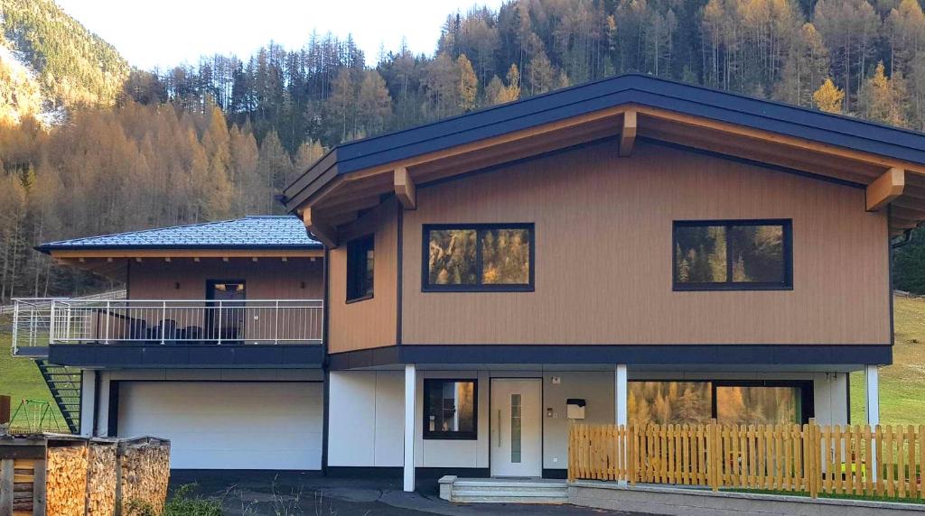 a large house with a porch and a balcony at Haus Fortuna in Sölden