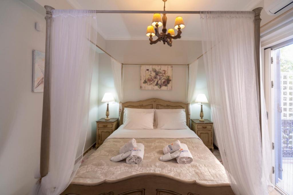 Posteľ alebo postele v izbe v ubytovaní Nautilus Luxury Suites