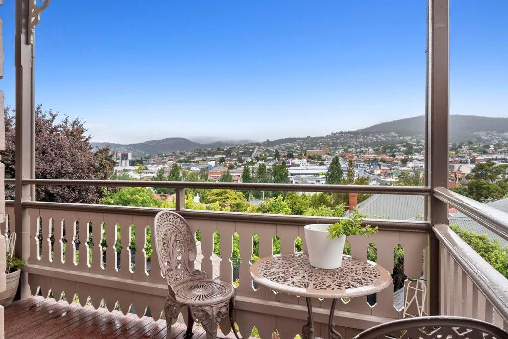 a balcony with a table and chairs and a view at Historic Home close to CBD 3Brm with views in Hobart