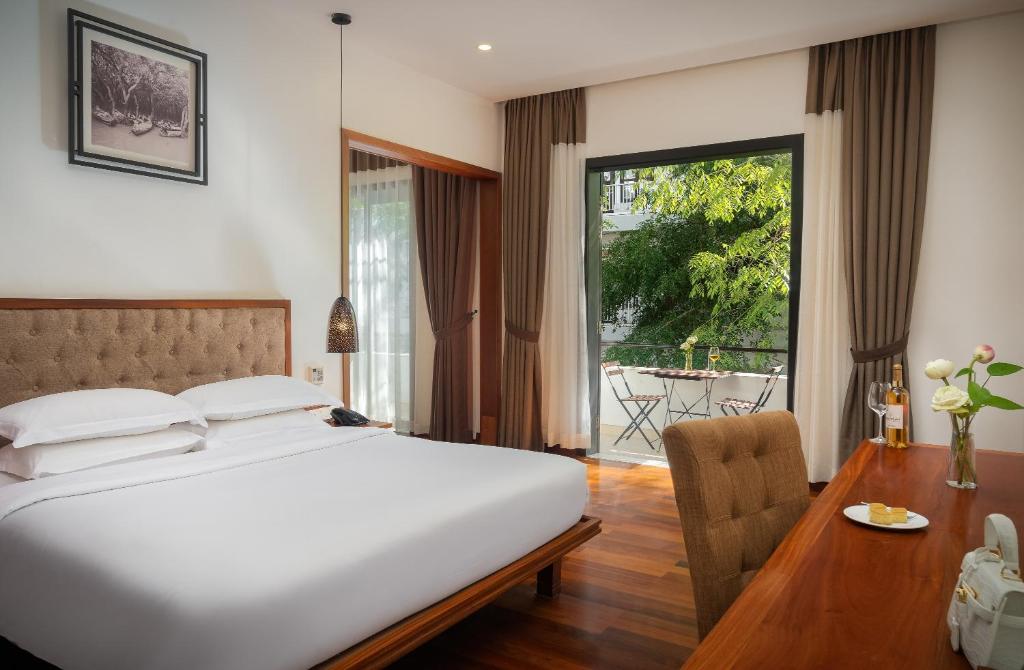 Postel nebo postele na pokoji v ubytování Koulen Hotel
