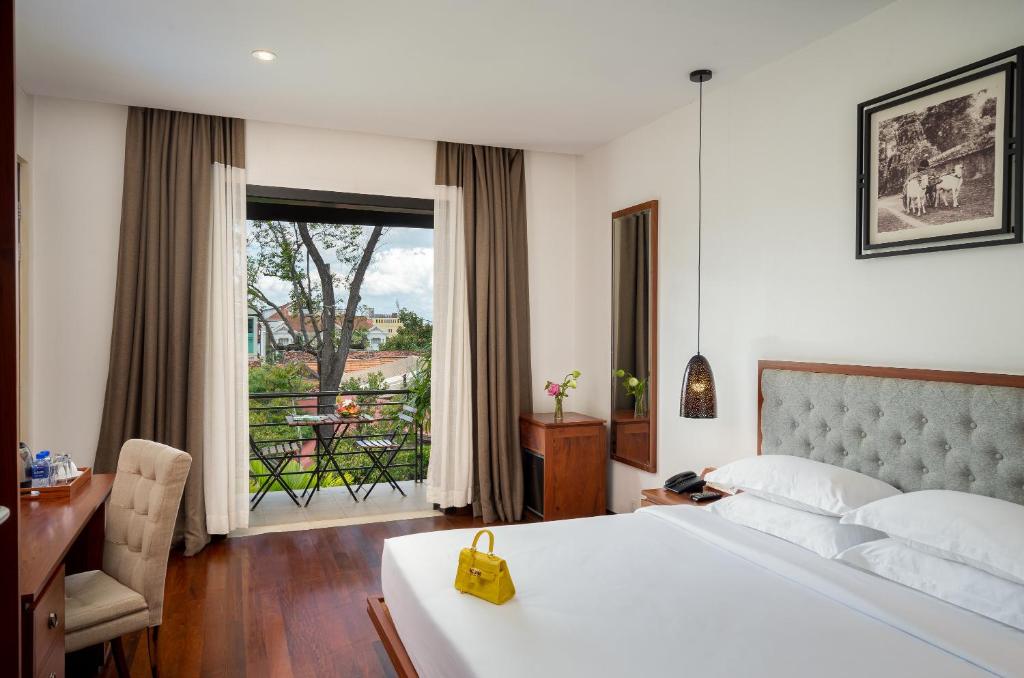 Postel nebo postele na pokoji v ubytování Koulen Hotel