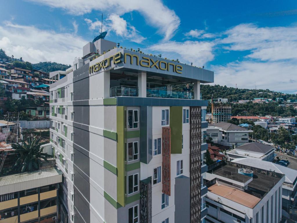 a building with a hotel inventory sign on top of it at MaxOneHotels at Jayapura in Jayapura