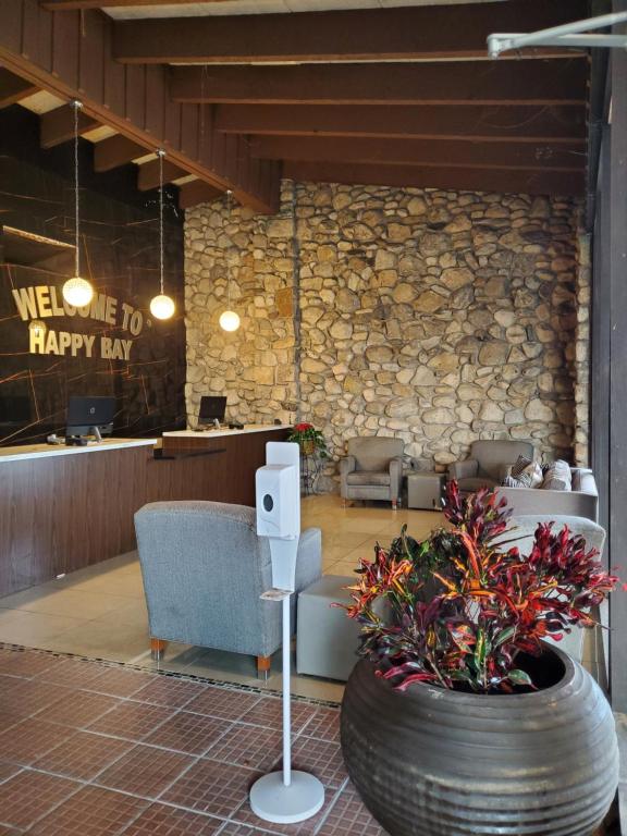 a lobby with a waiting area and a large tire at Happy Bay in Bay City