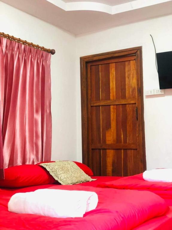 Postel nebo postele na pokoji v ubytování กอบสุข รีสอร์ท 2 k08 , k09