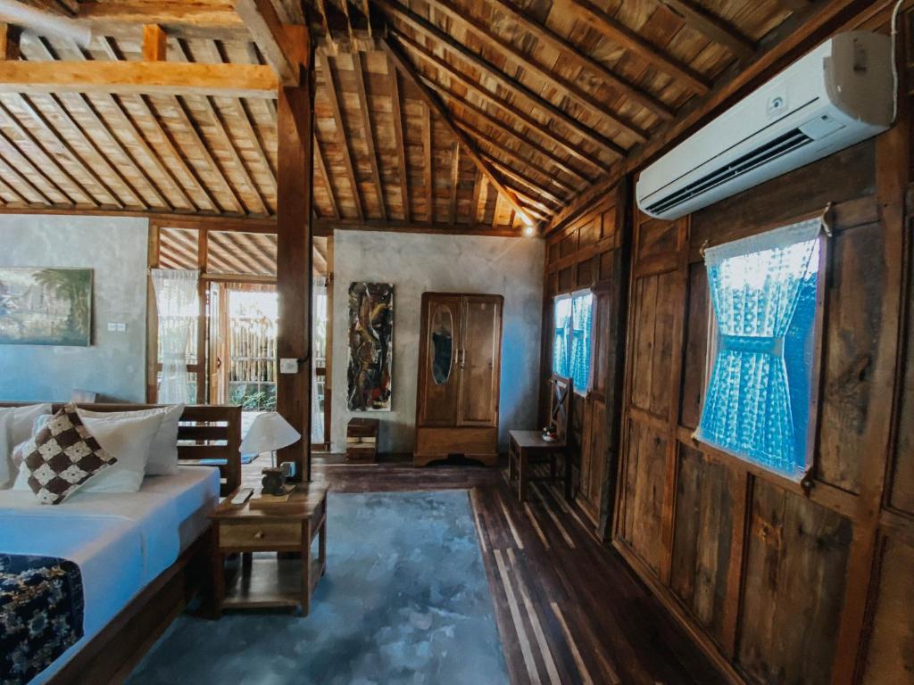 Postel nebo postele na pokoji v ubytování Sarini Villas