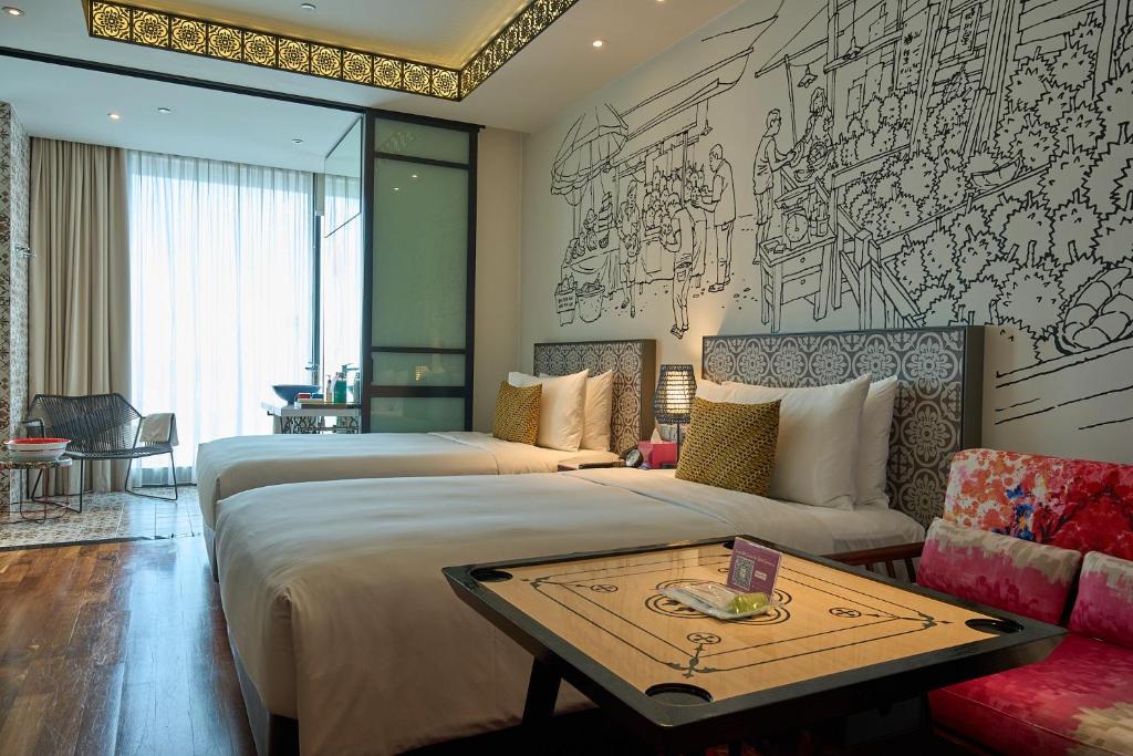 Giường trong phòng chung tại Hotel Indigo Singapore Katong by IHG