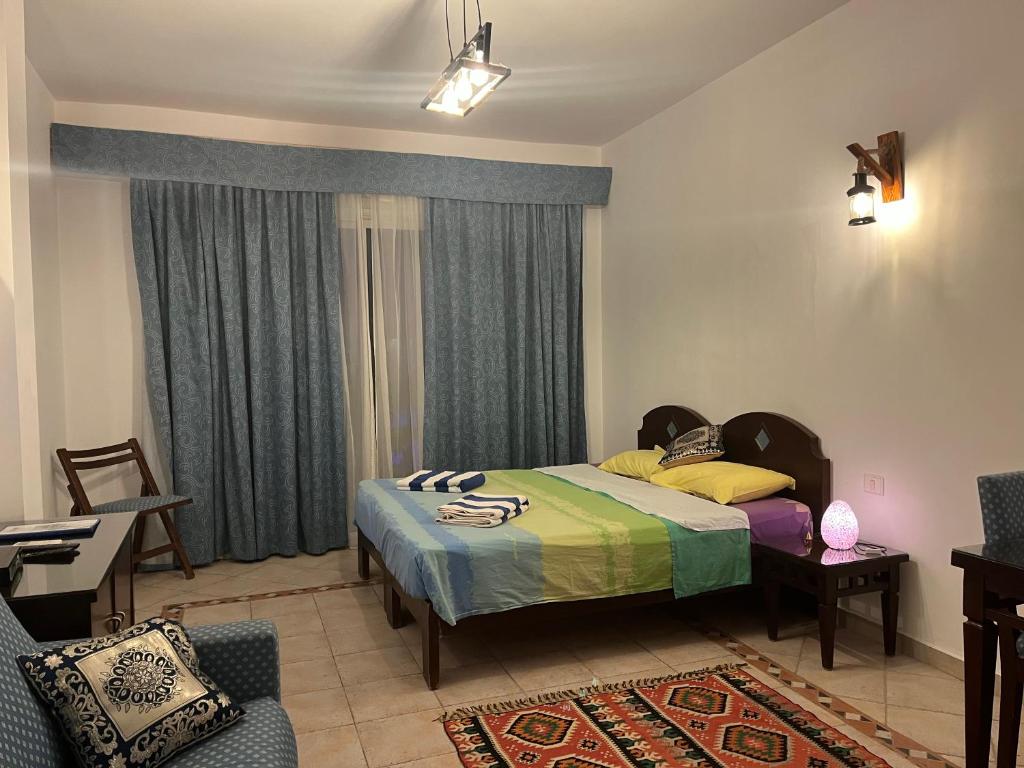 Postel nebo postele na pokoji v ubytování Deep Ashri Apartment