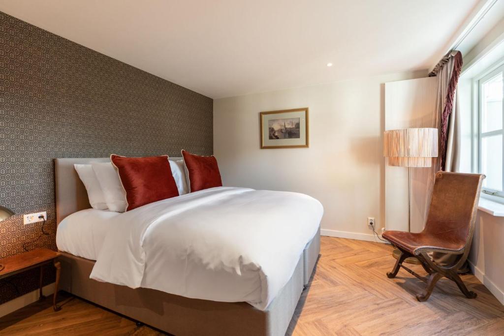 Postel nebo postele na pokoji v ubytování Boetiekhotel De Kastanjehof