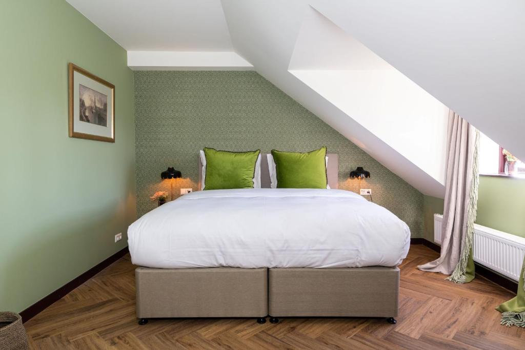 Postel nebo postele na pokoji v ubytování Boetiekhotel De Kastanjehof