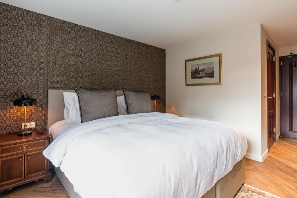 Postel nebo postele na pokoji v ubytování Boetiekhotel De Kastanjehof
