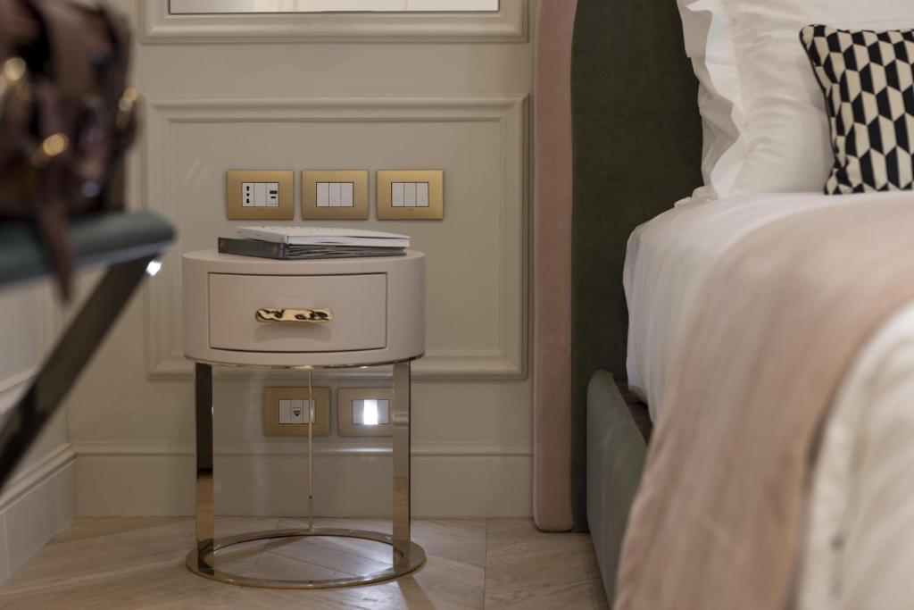 A bed or beds in a room at Hotel La Gemma