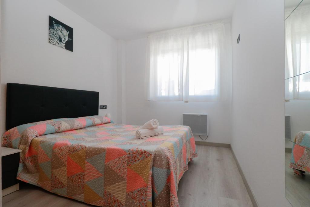 Postel nebo postele na pokoji v ubytování Apartamentos Araco 3000