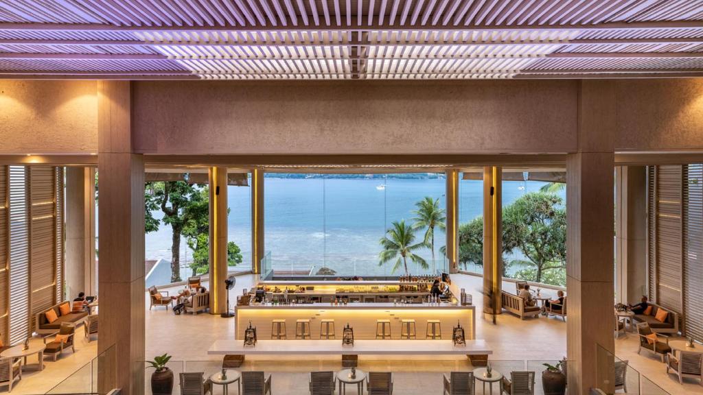 a large lobby with a view of the ocean at Amari Phuket in Patong Beach