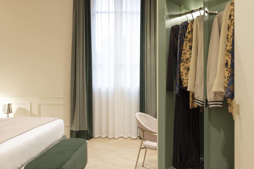 A bed or beds in a room at Hotel La Gemma