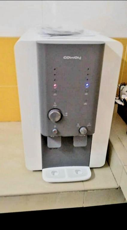 a white coffee maker sitting on top of a counter at Sakura Guest House in Cameron Highlands