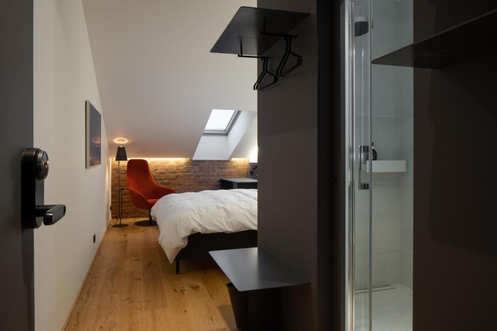Postel nebo postele na pokoji v ubytování Dunten Hotel