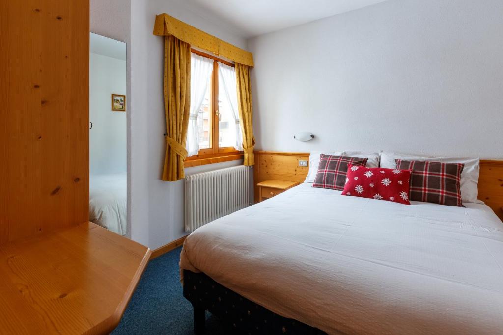 A bed or beds in a room at Residence Sci Sport