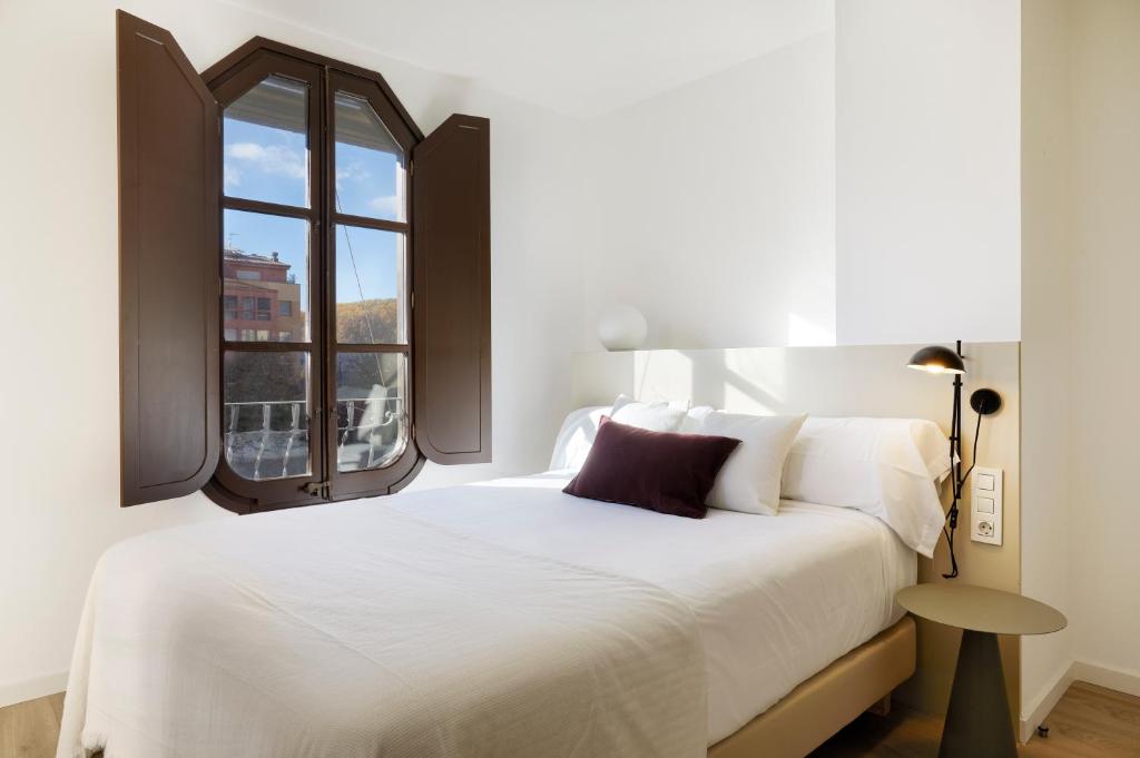 Postel nebo postele na pokoji v ubytování Canvas Apartments & Lofts Girona
