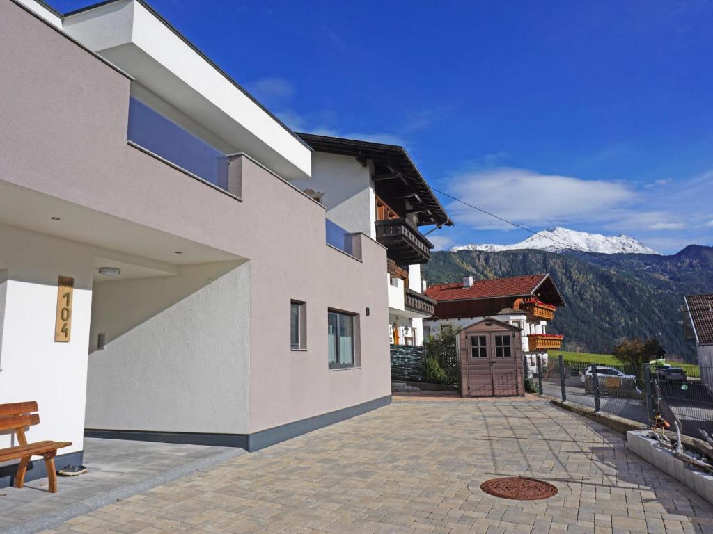 a white building with a view of a mountain at Apartment FeWo Anna by Interhome in Alterzoll