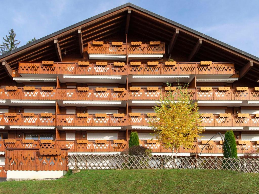 a building with a tree in front of it at Apartment Ambre 1 by Interhome in Villars-sur-Ollon