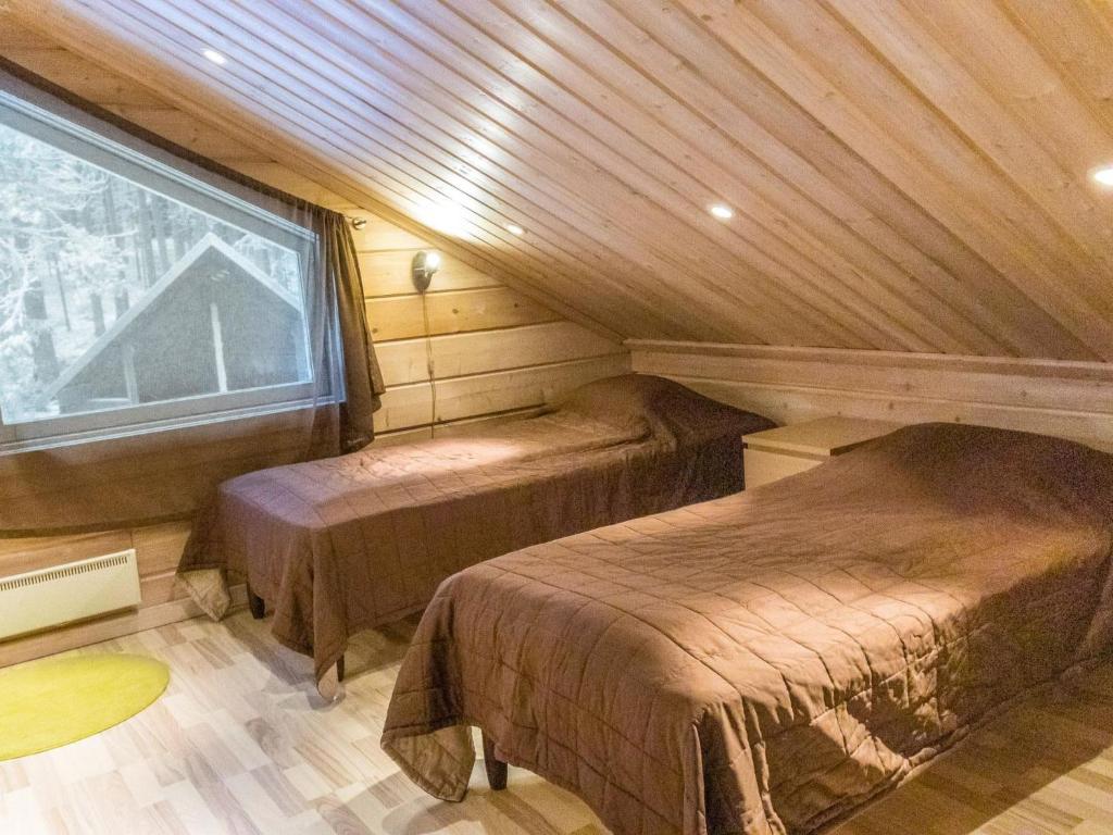 Postel nebo postele na pokoji v ubytování Holiday Home Pyhänkarhu 3 by Interhome