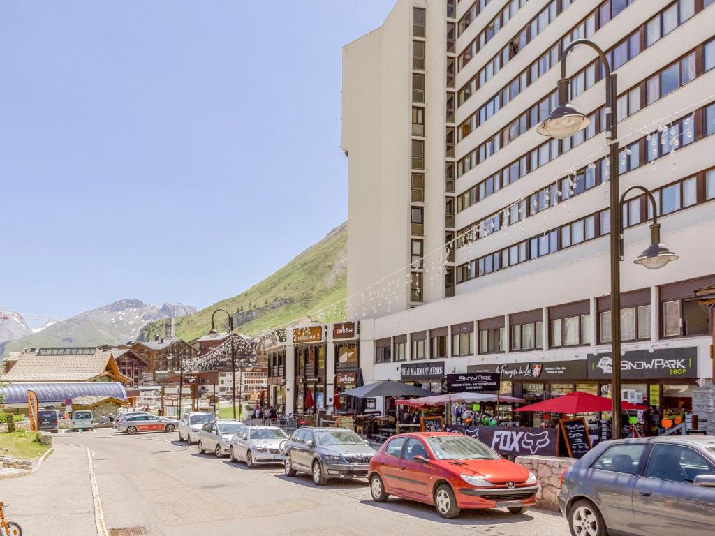 a street with cars parked in front of a building at Studio Palafour - Le Lac-6 by Interhome in Tignes