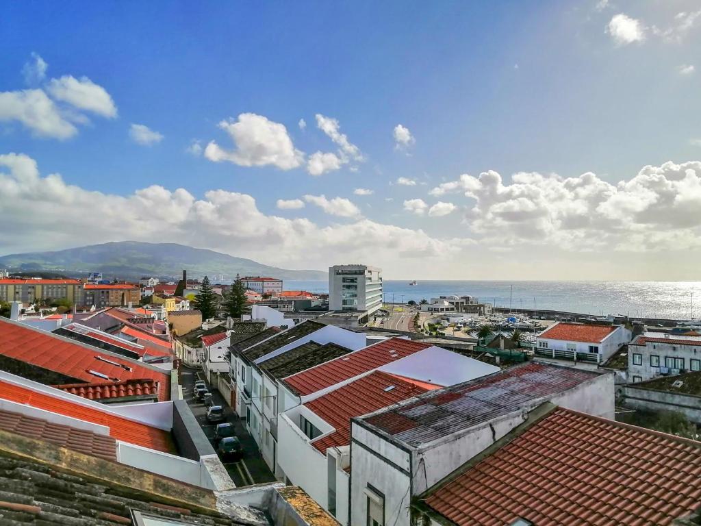a view of a city with buildings and the ocean at Ladeira Loft - Sea View in the City Center in Ponta Delgada