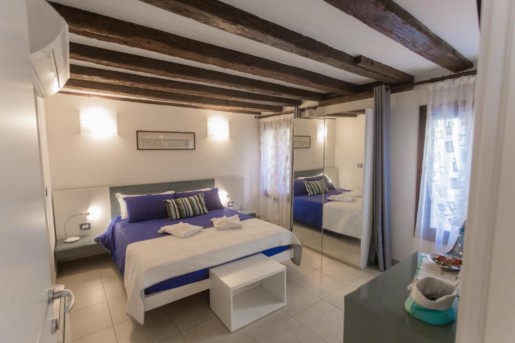 Posteľ alebo postele v izbe v ubytovaní B&B Antico Orologio
