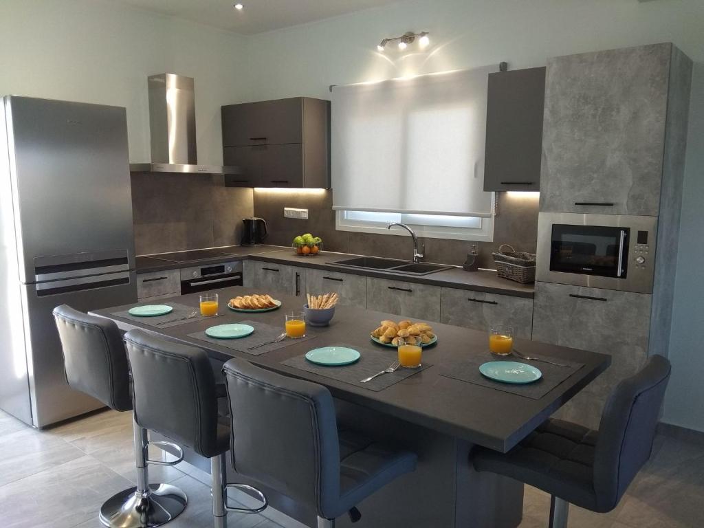 Kuchyň nebo kuchyňský kout v ubytování Spiridoula Luxury Villa