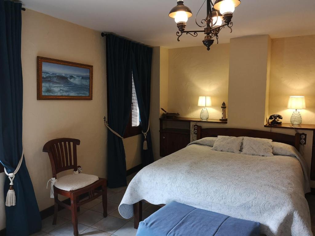 Postel nebo postele na pokoji v ubytování Hotel Triskel