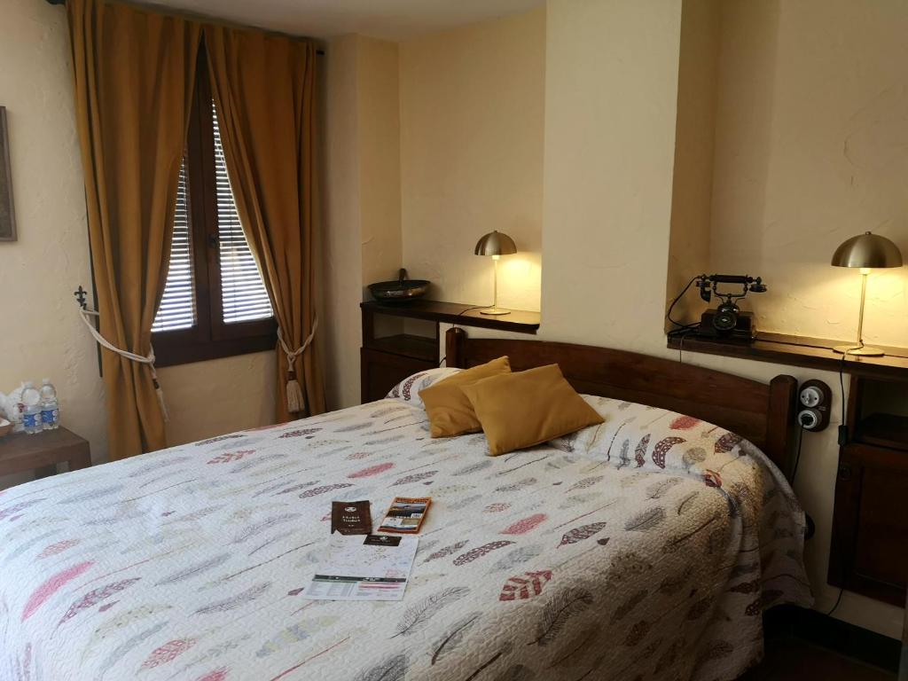 Postel nebo postele na pokoji v ubytování Hotel Triskel