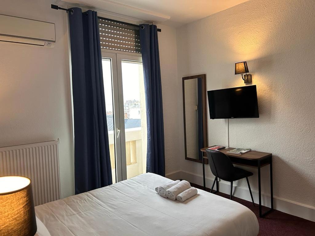 Postel nebo postele na pokoji v ubytování Hotel Moderne