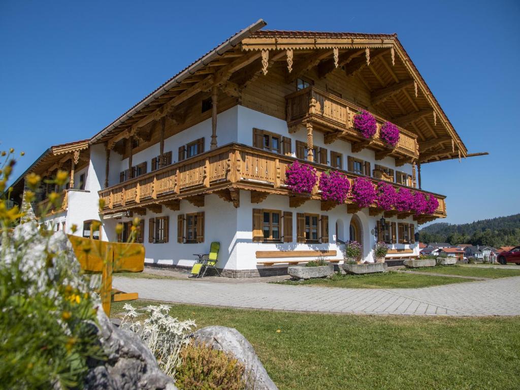 a building with flowers on the side of it at Wimmerhof in Inzell
