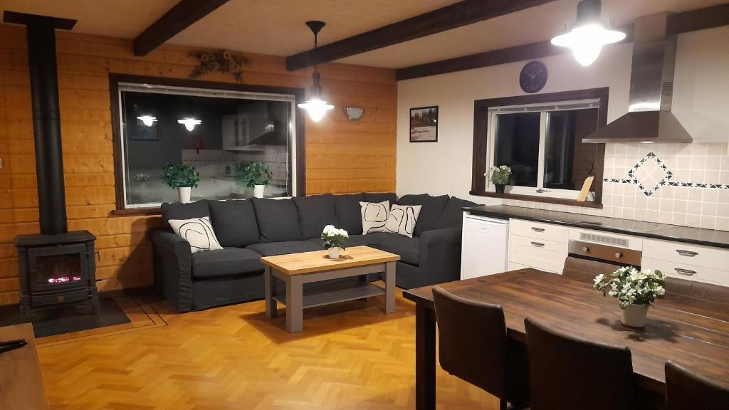 a living room with a couch and a table at Ristafallet in Åre
