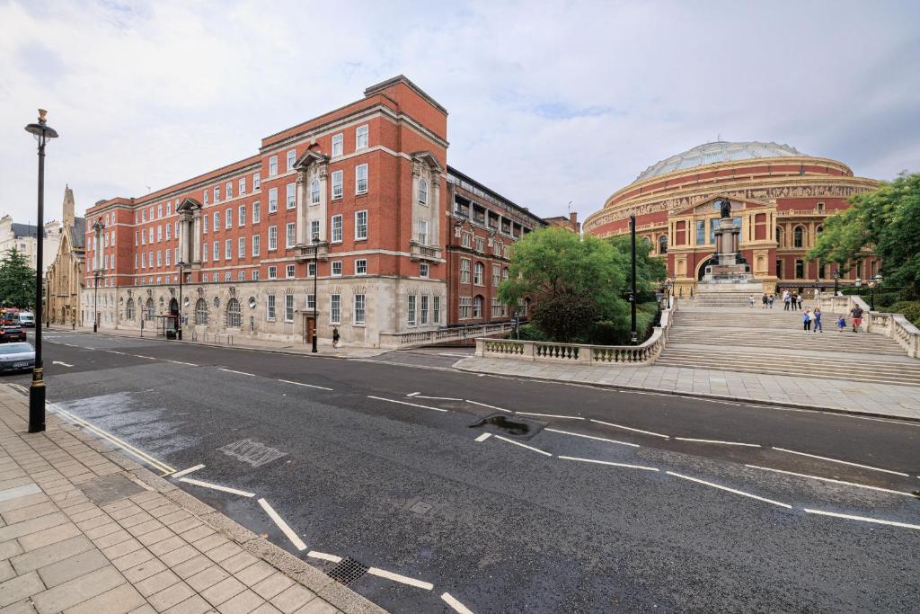 an empty street in front of a large brick building at Beit Hall in London