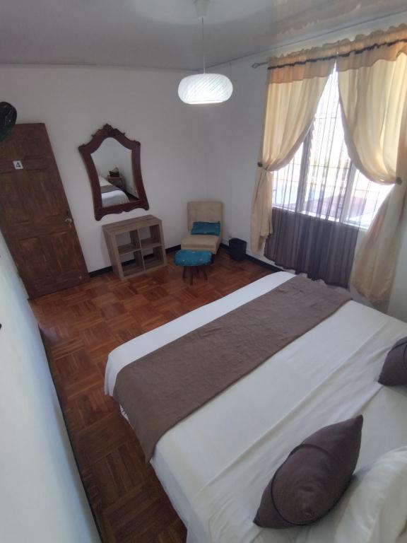 Postel nebo postele na pokoji v ubytování Lajuela BnB & Hostel