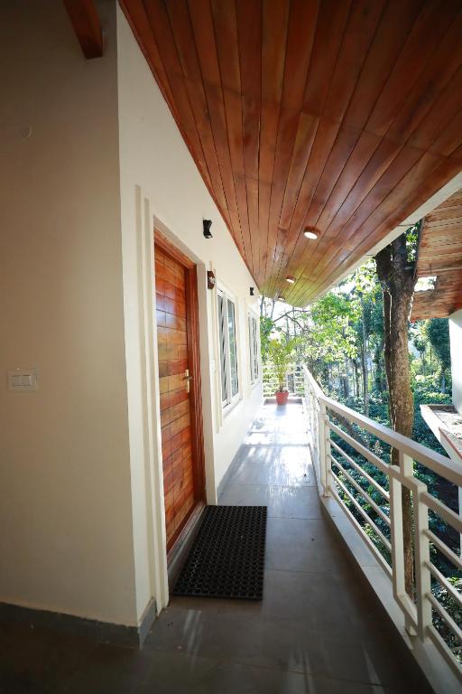 Balkón nebo terasa v ubytování Coorg Coffee Bean Resort