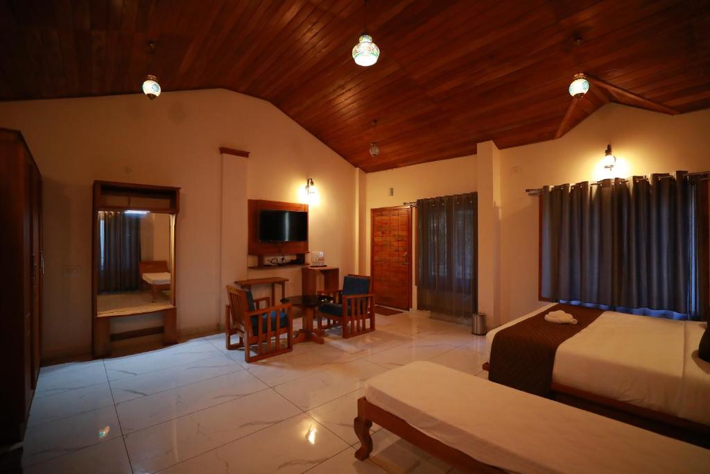 Postel nebo postele na pokoji v ubytování Coorg Coffee Bean Resort