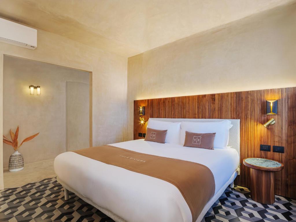 Letto o letti in una camera di Villa Riviera Resort