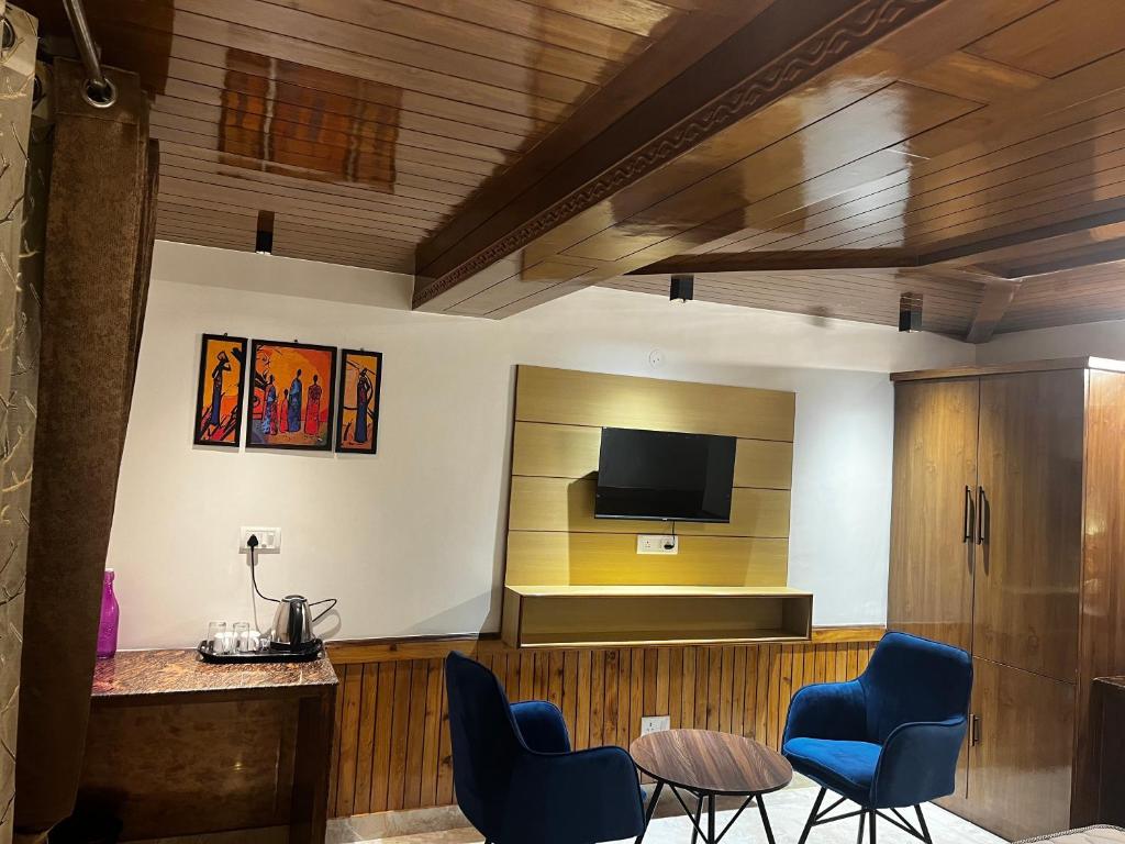 TV a/nebo společenská místnost v ubytování Calm Paradise