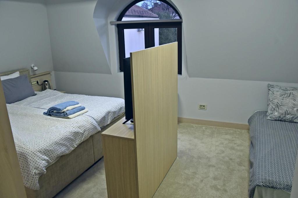 Postel nebo postele na pokoji v ubytování City SMART