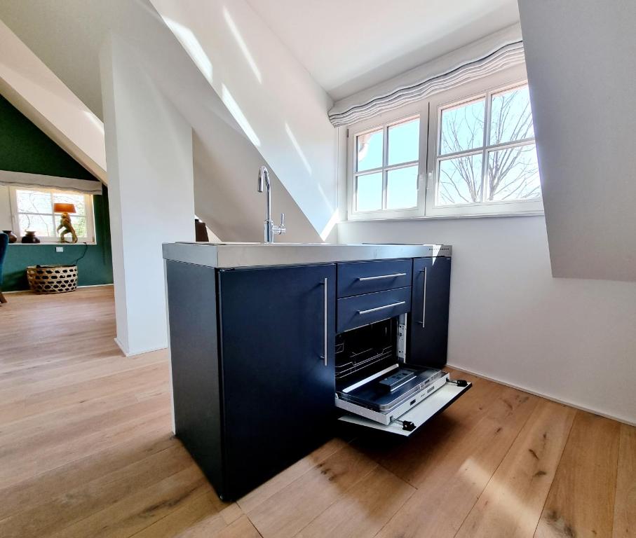 TV a/nebo společenská místnost v ubytování THUERS IM BUSCH - Upkammer - ab 3 Nächte - Ferienwohnungen mit Stil in Münster