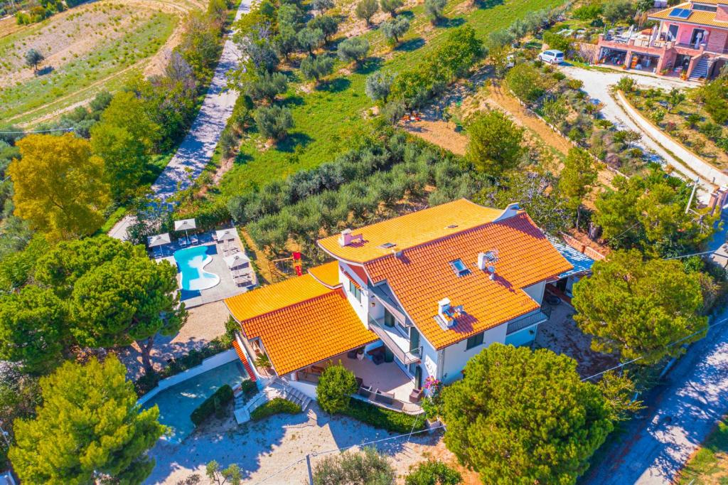 an overhead view of a house with an orange roof at Vista Allegra Pagoda - Villa con piscina in Colonnella
