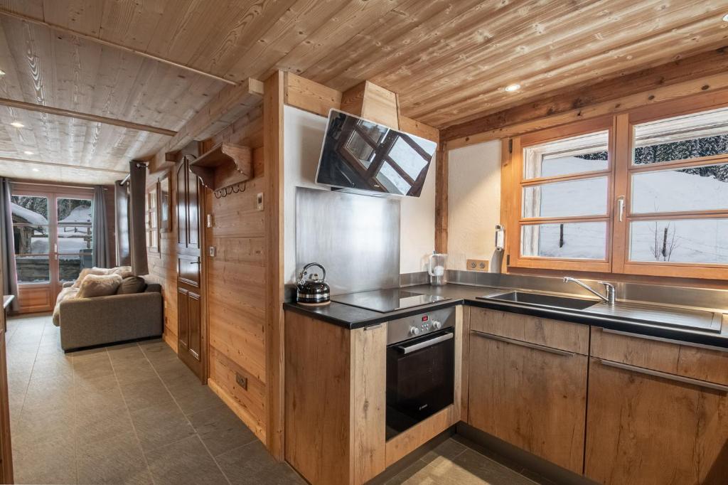Kuchyň nebo kuchyňský kout v ubytování Chalet Le R'Posiao