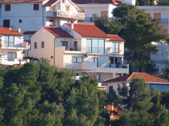 a group of houses on a hill with trees at Deluxe Jelsa in Jelsa